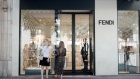Shoppers outside a Fendi SpA luxury goods store on Avenue Montaigne in Paris, France, on Sunday, July 24, 2022. 